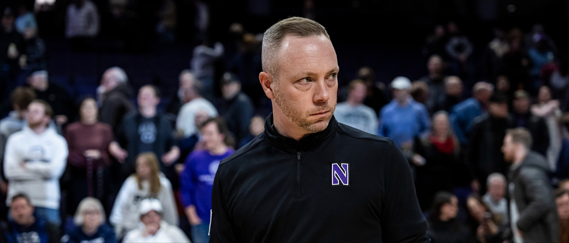 20260129_MBB_PSU_RK_218.jpg Northwestern men's basketball director of operations Chris Lauten looks on from the sideline before a game.
